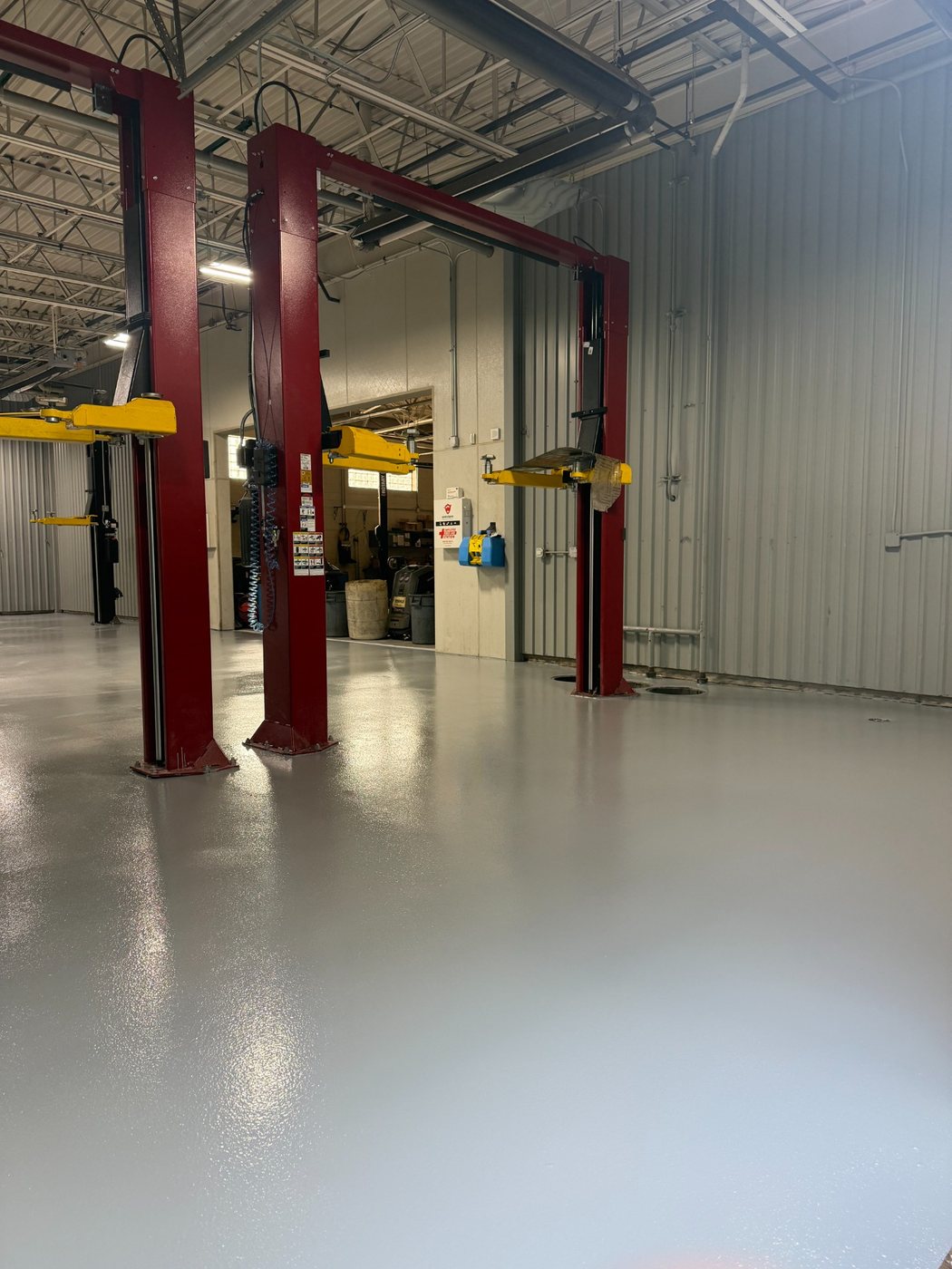 Finished epoxy broadcast floor at an Infinity dealer