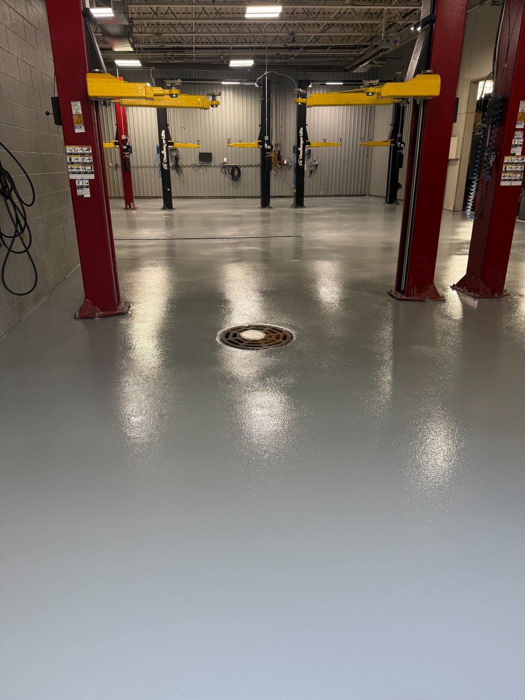 Finished epoxy broadcast floor at an Infinity dealer