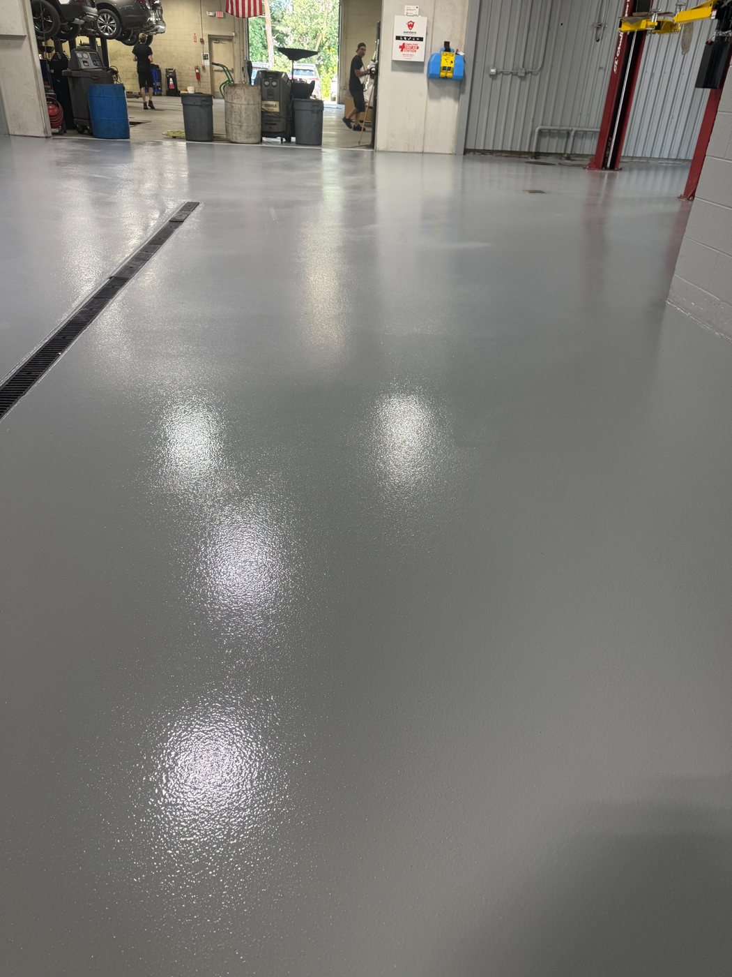 Finished epoxy broadcast floor at an Infinity dealer