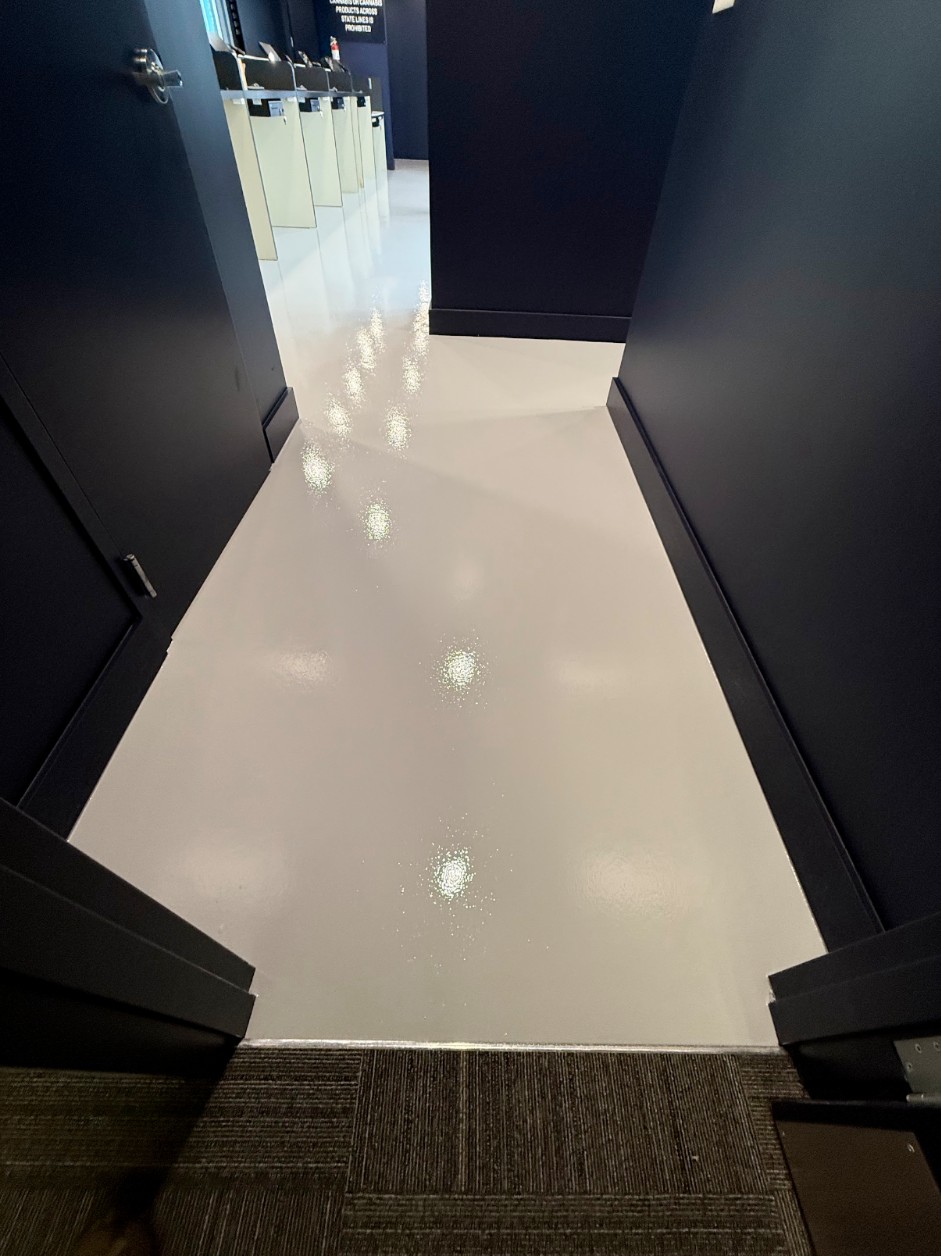 High-gloss white epoxy floor in a residential garage